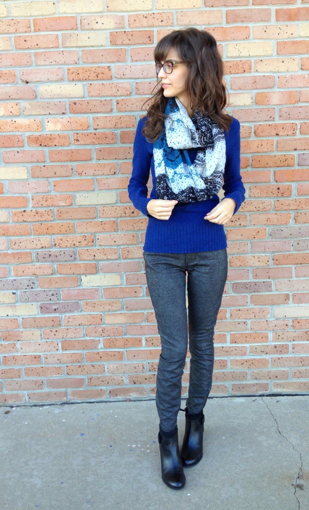 cold weather style: snake print jeans, sweater, and black booties