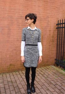 winter layers: sweater dress, white shirt, tights